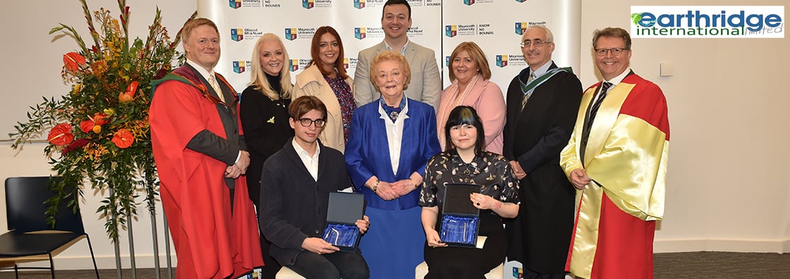 Two students receive their W.A Barrett Scholarship  from Maynooth University staff