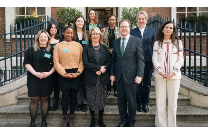 9 women and 1 man posing for picture outside Royal Irish Academy for International Women's Day