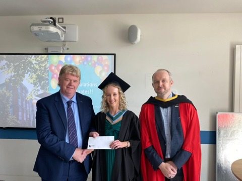 ASTI Presient Donal Cremin presents Abigail Mee with her ASTI award, with Dr Tom Delahunty