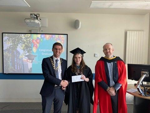 President of the TUI, David Ward, presents Aoife Mulally with her TUI award, and Dr Tom Delahunty.