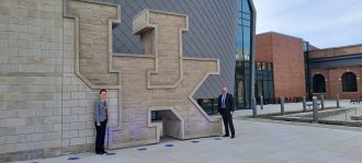 IO_Claire Doran and Dr. Emmanuel Kypraios outside the UK Student Center