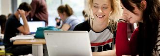 Female students at laptop