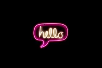A neon sign with the word hello in a voice bubble