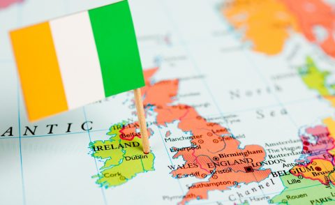 Map of Ireland beside the UK with a tricolour stuck in Dublin