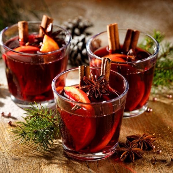 Three glases of red wine with oranges, cinnamon and star anise 