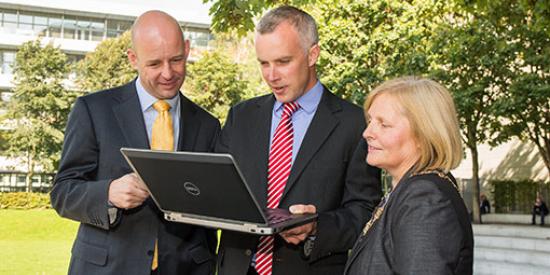 Communications & Marketing - Aero Map Launch Philip Nolan, Councillor Críona Ní Dhálaigh and Justin Gleeson holding laptop - Maynooth University