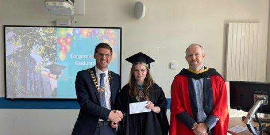 President of the TUI, David Ward, presents Aoife Mulally with her TUI award, and Dr Tom Delahunty.