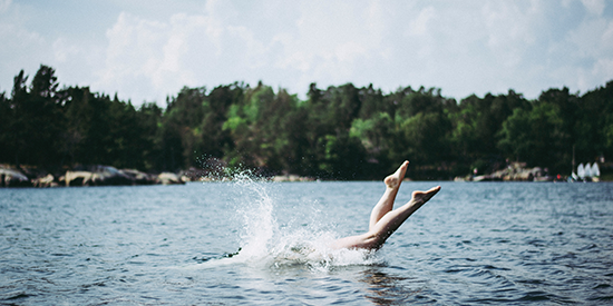 A person diving into a lake 