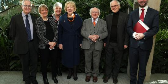 President Michael D Higgins poses with staff at Maynooth University