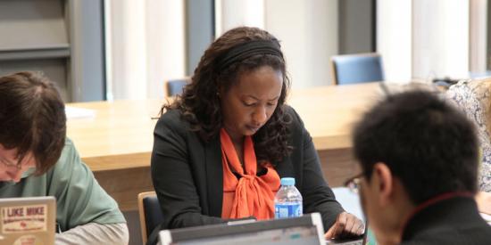 Postgraduate Student Studying in the Library at Maynooth University