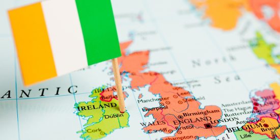 Map of Ireland beside the UK with a tricolour stuck in Dublin