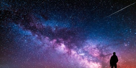silhouette of a man against a night sky