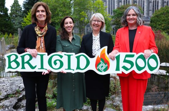 Four women standing in a row holding a banner that says Brigid 1500