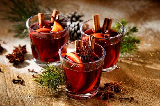 Three glases of red wine with oranges, cinnamon and star anise 